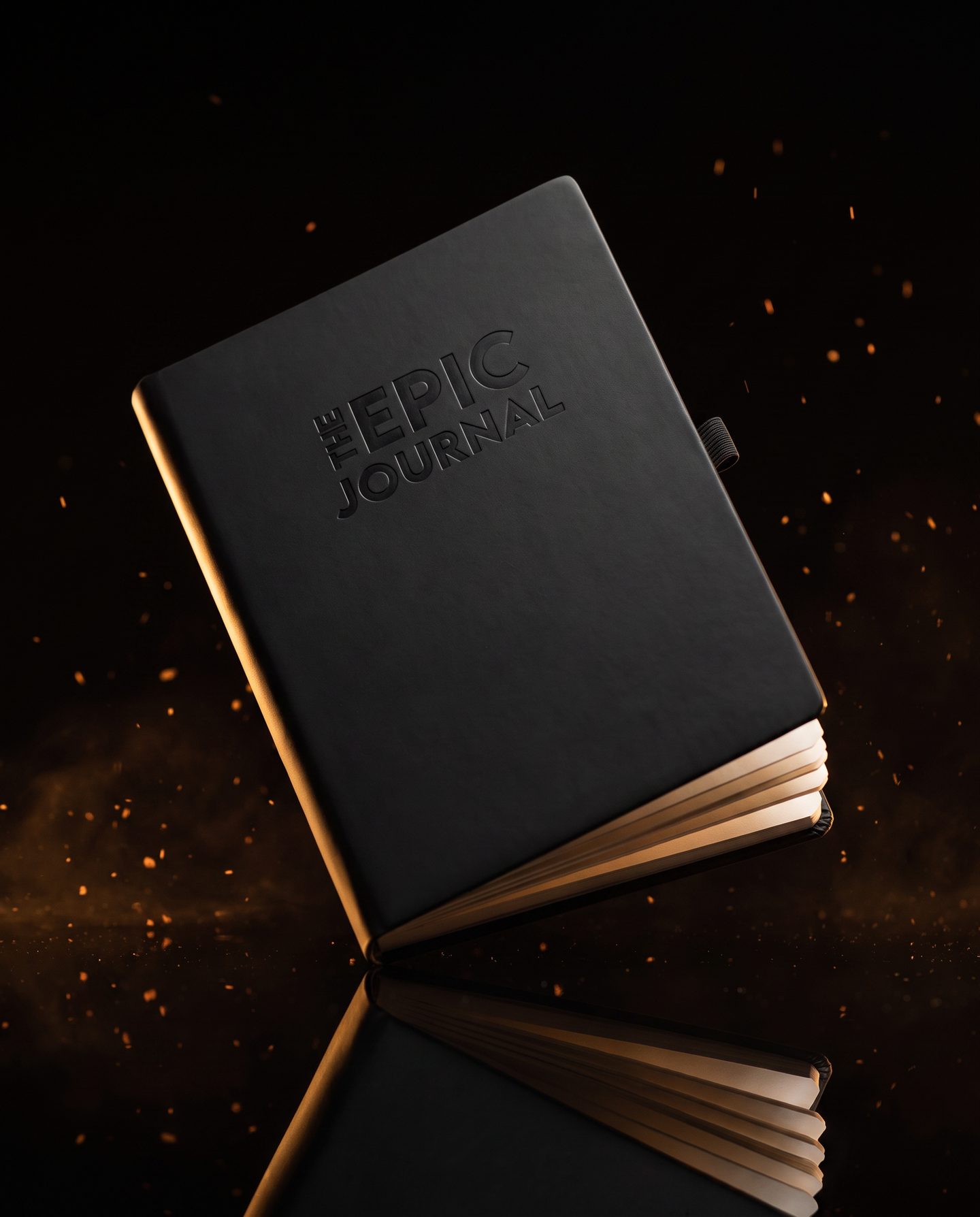 The Epic Journal levitating over a reflective surface with ember light