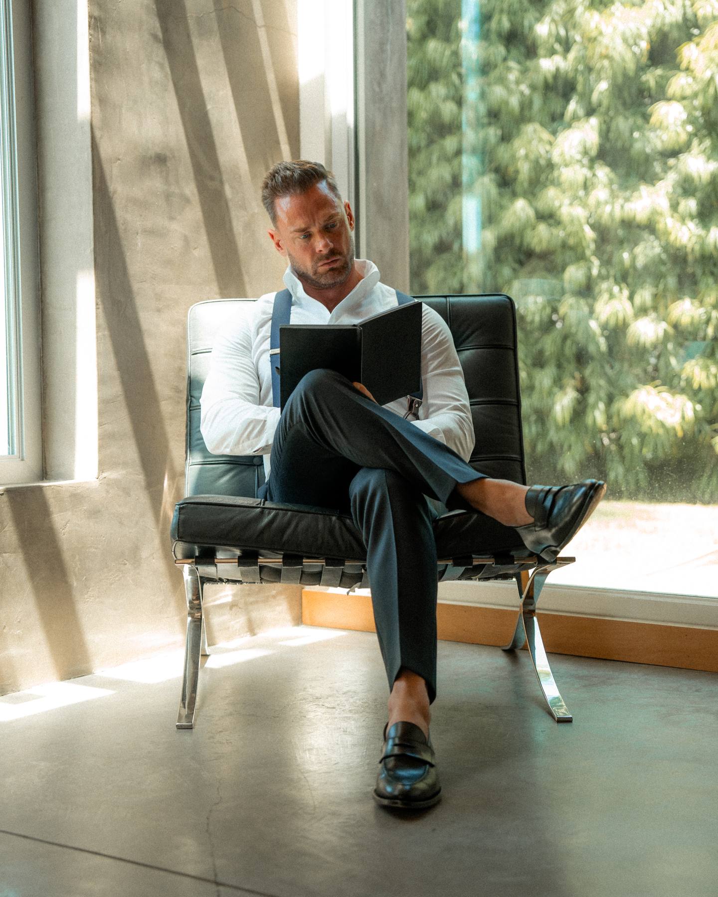 Reading the journal in a modern architectural space
